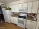 White appliances and cabinets, neutral countertops at 4065 E University Dr # 373, Mesa, AZ 85205