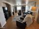 Living room with leather furniture and hardwood floors at 4065 E University Dr # 373, Mesa, AZ 85205
