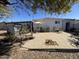 Spacious patio with seating area, pergola, and mature plants at 4065 E University Dr # 373, Mesa, AZ 85205