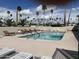 Refreshing pool area with lounge chairs and surrounding palm trees at 4065 E University Dr # 373, Mesa, AZ 85205