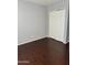 Spacious bedroom with dark wood laminate flooring and large closet at 4142 N 11Th St # 4, Phoenix, AZ 85014