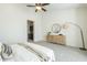 Bright bedroom with a queen-size bed, dresser, and large mirror at 4409 N 24Th Pl, Phoenix, AZ 85016