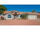 Single-story home with a terracotta tile roof and landscaped front yard at 4550 E Charleston Ave, Phoenix, AZ 85032