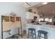 Modern kitchen with white cabinets, quartz countertops, and stainless steel appliances at 4550 E Charleston Ave, Phoenix, AZ 85032