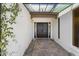 Inviting entryway with double doors, brick pathway, and covered walkway at 506 E Tam Oshanter Dr, Phoenix, AZ 85022