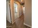 Hallway with hardwood floors and doors to bedrooms at 5801 N 23Rd Ave, Phoenix, AZ 85015