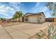 Front view of a single story house with a driveway at 733 E Halifax St, Mesa, AZ 85203