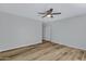 Bright bedroom with ceiling fan and hardwood floors at 9313 W Brown St, Peoria, AZ 85345