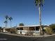 Single-wide manufactured home with covered porch and desert landscaping at 9501 E Broadway Rd # 269, Mesa, AZ 85208