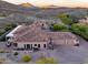 Aerial view of house, highlighting its expansive size and mountain views at 10030 N 23Rd St, Phoenix, AZ 85028