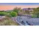 Landscaped backyard with mountain views and a rock wall at 10030 N 23Rd St, Phoenix, AZ 85028