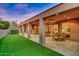 Spacious covered patio with seating area, artificial turf, and mountain views at 10030 N 23Rd St, Phoenix, AZ 85028