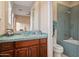 Bathroom with glass vessel sink and mosaic tile shower at 10030 N 23Rd St, Phoenix, AZ 85028