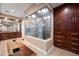 Spa-like bathroom with walk-in shower and built-in cabinetry at 10030 N 23Rd St, Phoenix, AZ 85028