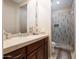 Well-appointed bathroom with a walk-in shower and modern vanity at 10030 N 23Rd St, Phoenix, AZ 85028