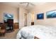 Bright bedroom with built-in workspace and en-suite bathroom access at 10030 N 23Rd St, Phoenix, AZ 85028