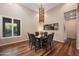 Formal dining room with hardwood floors and a modern chandelier at 10030 N 23Rd St, Phoenix, AZ 85028