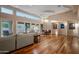 Bright living room with hardwood floors, large windows, and ample seating at 10030 N 23Rd St, Phoenix, AZ 85028