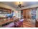 Home office with built-in bookshelves and hardwood floors at 10030 N 23Rd St, Phoenix, AZ 85028