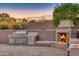 Custom outdoor grill and fireplace area at 10030 N 23Rd St, Phoenix, AZ 85028