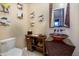 Elegant powder room with a unique vessel sink and decorative mirror at 10030 N 23Rd St, Phoenix, AZ 85028