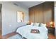 Modern bedroom with wood accent wall, large bed, and stylish decor at 1130 N 2Nd St # 104, Phoenix, AZ 85004