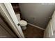 Small bathroom with toilet and wood-like wall accents at 1167 W Dana Dr, San Tan Valley, AZ 85143