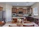 Well-equipped kitchen featuring granite countertops and ample cabinetry at 11918 W Jessie Ln, Sun City, AZ 85373