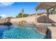 Inviting pool with a waterfall feature and spa at 11918 W Jessie Ln, Sun City, AZ 85373