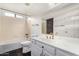 Bathroom with a bathtub, toilet and white vanity at 12838 S 40Th Pl, Phoenix, AZ 85044