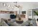 Open living room with vaulted ceiling, and view of kitchen at 12838 S 40Th Pl, Phoenix, AZ 85044