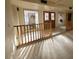 Bright entryway with wood railing and stained glass windows at 15326 E Mustang Dr, Fountain Hills, AZ 85268