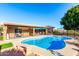 Inviting kidney shaped pool with a patio and seating area at 16437 E Desert Sage Dr, Fountain Hills, AZ 85268