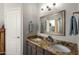 Double vanity bathroom with granite countertops at 17221 N Thornberry Dr, Surprise, AZ 85374