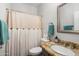 Clean bathroom with granite countertop, shower, and updated fixtures at 17221 N Thornberry Dr, Surprise, AZ 85374