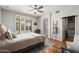 Bright bedroom with sliding door to backyard and ceiling fan at 17221 N Thornberry Dr, Surprise, AZ 85374