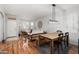 Open concept dining area with wood floors and light walls at 17221 N Thornberry Dr, Surprise, AZ 85374