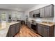 Granite countertops and stainless steel appliances in this kitchen at 17221 N Thornberry Dr, Surprise, AZ 85374