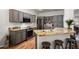 Kitchen with granite countertops, gray cabinets, and stainless steel appliances at 17221 N Thornberry Dr, Surprise, AZ 85374