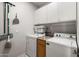 Convenient laundry room with washer, dryer, and cabinets at 17221 N Thornberry Dr, Surprise, AZ 85374
