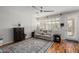 Bright living room featuring a comfy couch and wood floors at 17221 N Thornberry Dr, Surprise, AZ 85374