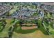 Aerial view of community with tennis courts and gated entry at 18048 W Spencer Dr, Surprise, AZ 85374