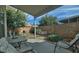 Covered patio furniture with a view of the backyard and block wall at 18048 W Spencer Dr, Surprise, AZ 85374