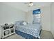 Bedroom with a floral bedspread and window coverings at 18048 W Spencer Dr, Surprise, AZ 85374