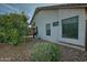 Back exterior of the house showing a portion of the backyard at 18048 W Spencer Dr, Surprise, AZ 85374