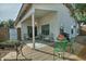 Covered patio with seating area and small table at 18048 W Spencer Dr, Surprise, AZ 85374