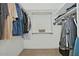 Large walk-in closet with double hanging rods and shelving at 18048 W Spencer Dr, Surprise, AZ 85374
