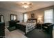 Spacious Primary bedroom with dark wood furniture at 18435 N 125Th Ave, Sun City West, AZ 85375