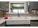 Farmhouse sink with gray shaker cabinets and mosaic backsplash at 18435 N 125Th Ave, Sun City West, AZ 85375
