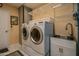 Laundry room with washer, dryer, and utility sink at 18435 N 125Th Ave, Sun City West, AZ 85375